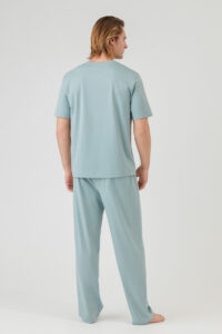 Back view of a man wearing a lightweight Manito Comfy cotton silk crew neck short-sleeve T-shirt with a relaxed fit.