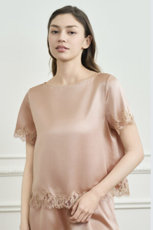 Upper-body view of a woman in the Windy Women's Silk Short-Sleeve Pajama, with a clean neckline and an easy look.