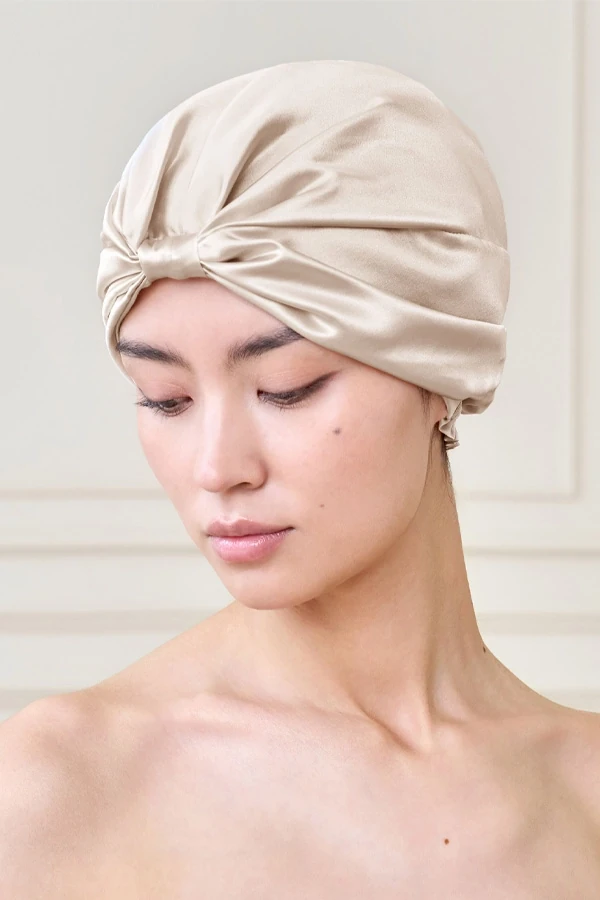 MANITO silk sleep cap as a no-tie alternative to a silk scarf for overnight hair protection.