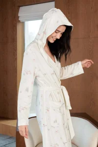 Close-up of Snow Puppy Women's Knit Robe featuring the plush hooded collar and delicate puppy-skiing print.